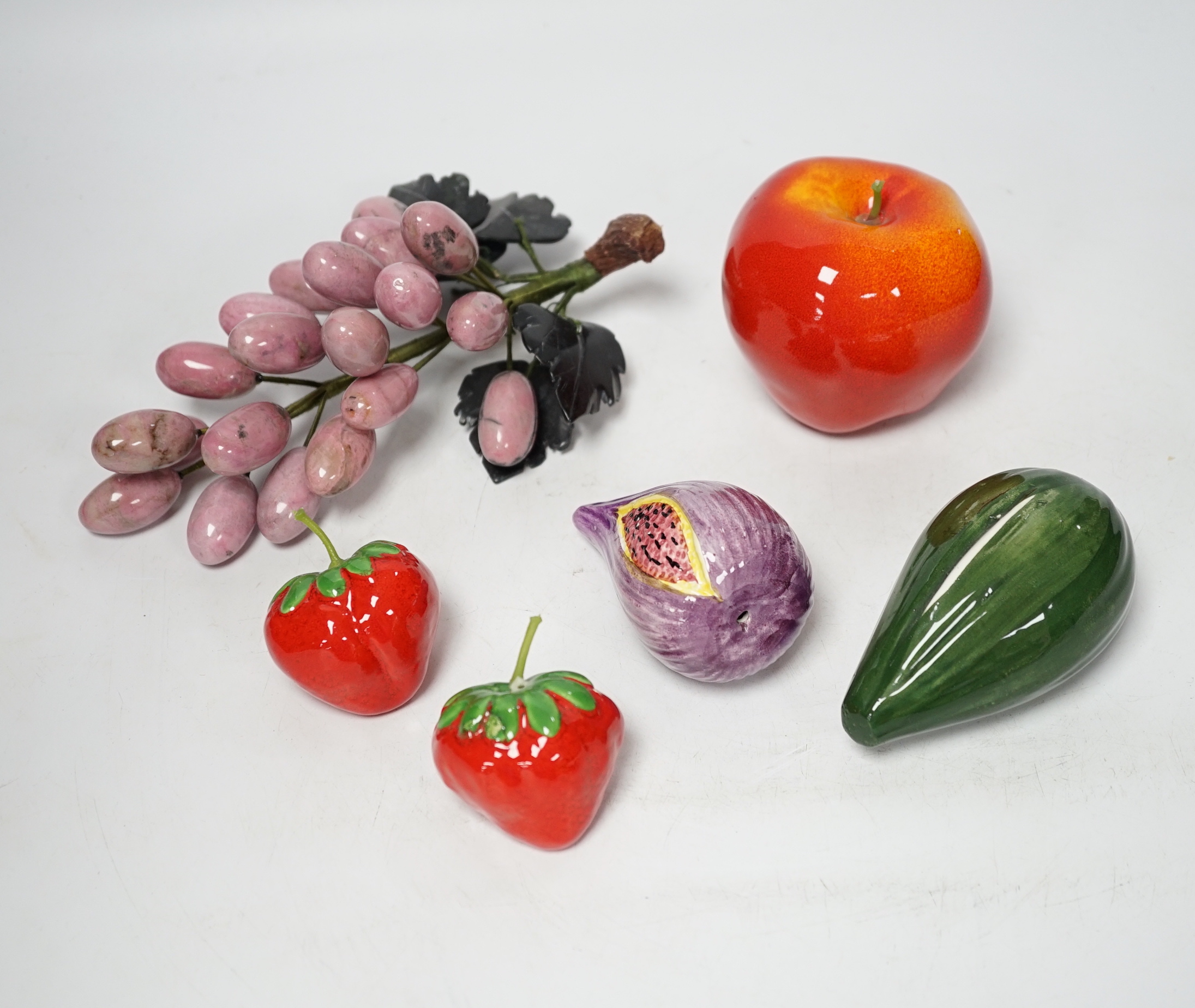 Five polished hardstone and soapstone bunches of grapes and six glazed china fruits, banana 19cm long (11)
